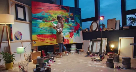 Back view of Caucasian young talented female artist working in own cozy workshop Stock Footage 149578322