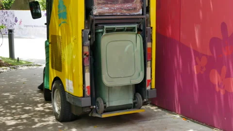 Back view of cleaning sweeping vehicle with garbage can on Sentosa Island in Stock Footage 175718810