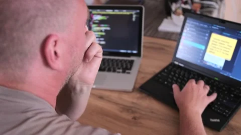 Back view close up focused IT specialist is typing on laptop. Work at home. 스톡 동영상 243575918