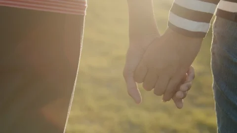 Back view. Close-up of hand Asian families holding  hand Stock Footage 124854422