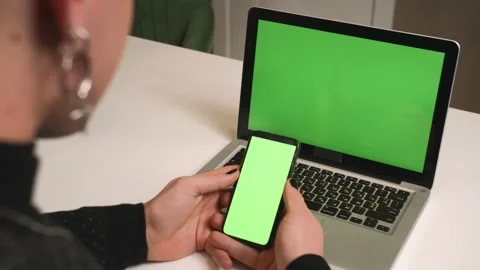 Back view. Close up homosexual man with a manicure use laptop green screen Stock Footage 146907969