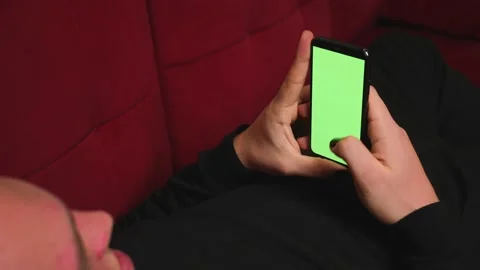 Back view. Close up homosexual man with manicure holding chromakey green screen 스톡 동영상 146908170
