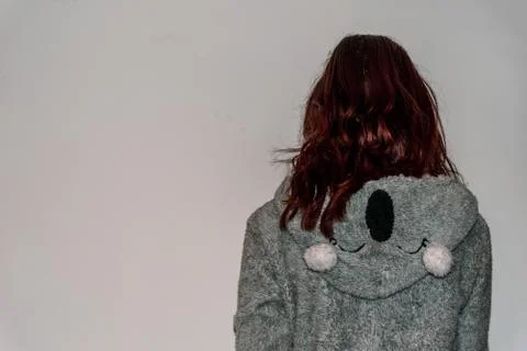 A back view close-up shot of an unrecognizable young Caucasian redhead woman  Stock Photos