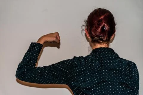 A back view close-up shot of an unrecognizable young Caucasian redhead woman  Stock Photos