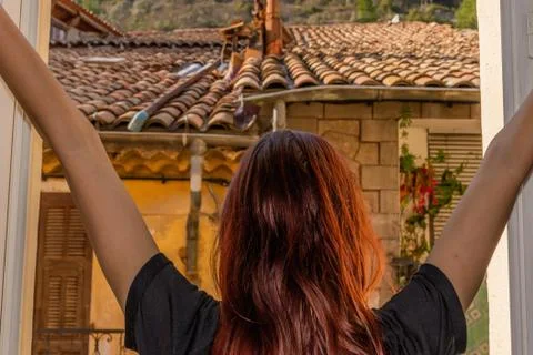 A back view close-up shot of an unrecognizable young Caucasian redhead woman  Stock Photos