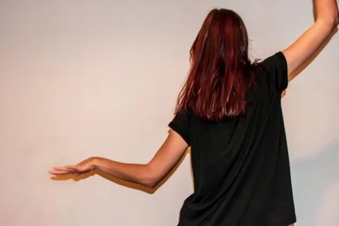 A back view close-up shot of an unrecognizable young Caucasian redhead woman  Stock Photos