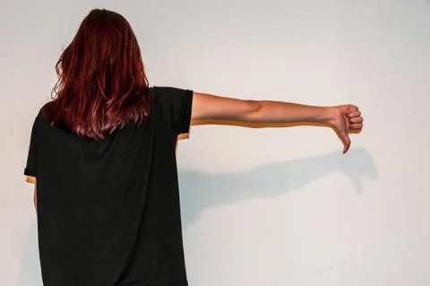 A back view close-up shot of an unrecognizable young Caucasian redhead woman  Stock Photos