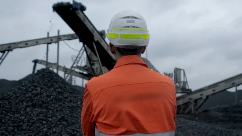 A back view of a coal miner observing coal production process Stock Footage 101504147