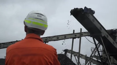 A back view of a coal miner observing coal mining process Stock Footage 101505569