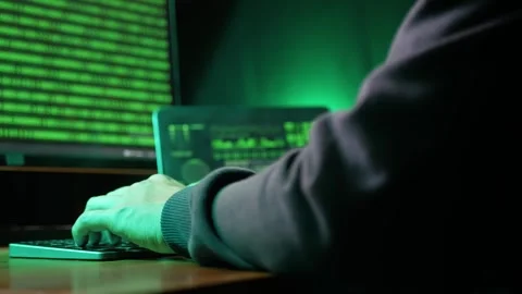 Back view of computer hacker's hand typing code on keyboard at dark room 库存影片 280177375