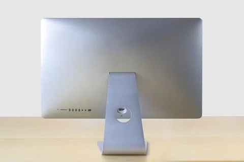 Back view of an computer on a wooden table with a white background Stock Photos