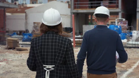 Back view of Confident female engineer leading construction project discuss.. Stock Footage 329641062