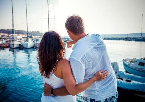 Back view, couple hug on boat marine background Stock Photos