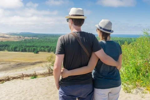 Back view of couple looking panoramic scenery Stock Photos