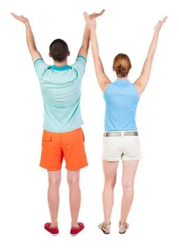 Back view couple  looking at wall and Holds  hand up 스톡 사진