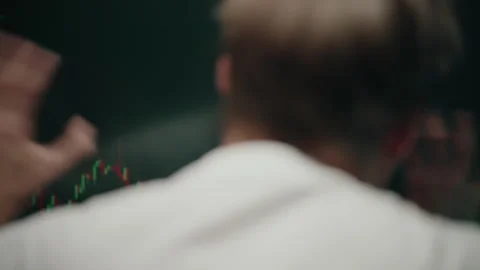 Back view of crazy stock trader gesturing and analyzing real-time data, charts Stock Footage 318466531
