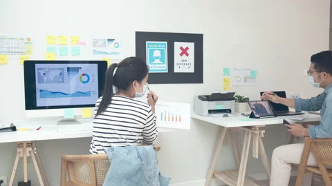 Back view of creative team staff wear face mask talking, brainstorming Video stock 140162401
