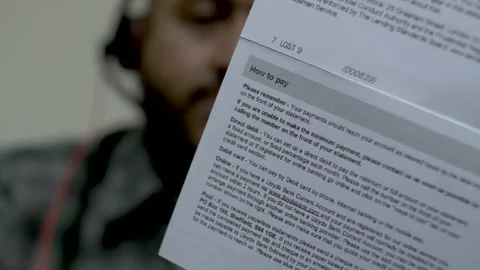 Back View Of Credit Card Statement With How To Pay Instructions With Bokeh Video stock 172164510