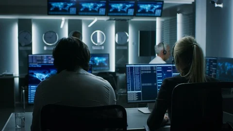 Back View of the Cyber Security Dispatchers Working on Personal Computer Stock Footage 94601003
