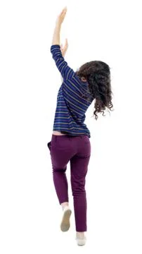 Back view of dancing young beautiful  woman. girl  watching Stock Photos