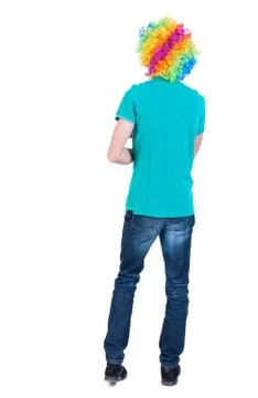 Back view of dancing young beautiful  man  in clown wig Stock Photos