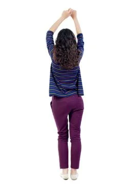 Back view of dancing young beautiful  woman. girl  watching Stock-Fotos