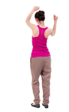 Back view of dancing young beautiful  woman. girl  watching Stock Photos
