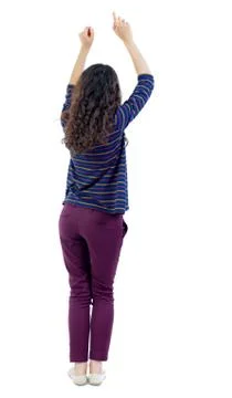 Back view of dancing young beautiful  woman. girl  watching Stock Photos
