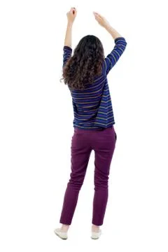 Back view of dancing young beautiful  woman. girl  watching Foto stock
