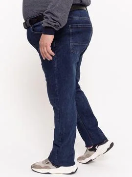 Back view of dark denim jeans legs with hand in pocket Stock Photos