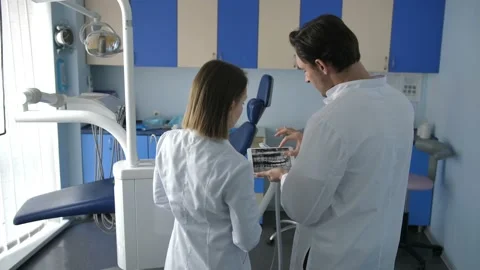 Back view of dental coworkers using tablet pc Stock Footage 89782368