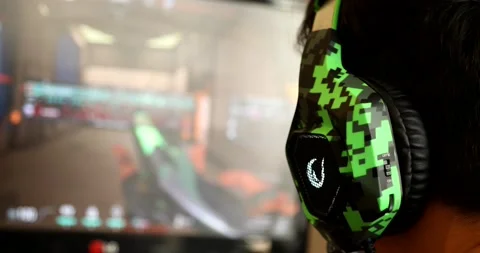 Back view of dependent gamer boy with headphone 3 Stock Footage 140916468