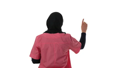 Back view of a doctor in hijab is tapping on objects. Isolated on a white Stock Footage 168804432