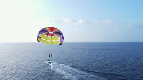 Back View of Double Parasailing Canopy Tugged by Motorboat, Drone Wide Shot Stock Footage 274179754