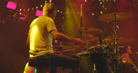 Back view of drummer playing drums at the stage on live concert Stock Footage 197006584
