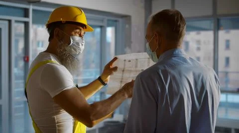 Back view of engineer and architect working on construction site and inspect Foto stock
