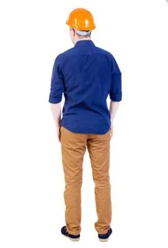 Back view of an engineer in the construction helmet stands Foto stock