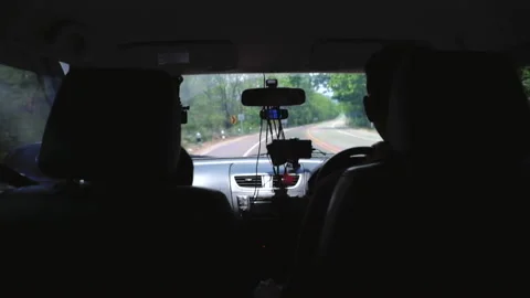 Back view of Father and son driving car on road. Stock Footage 154525187
