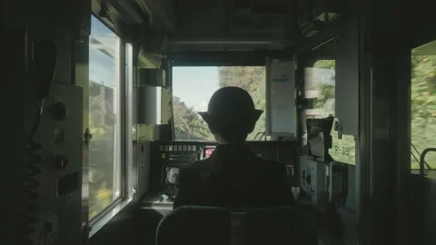 Back View Of A Female Conductor At The Train Cockpit Pointing While Stock Footage 158352602
