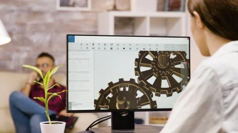 Back view of female engineer working on a mechanical concept Stock Photos