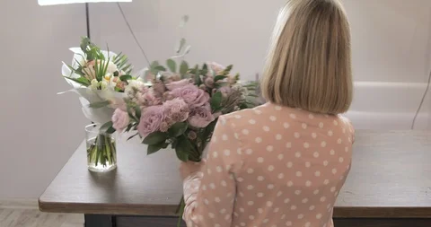 Back View Of Female Florist Making Beautiful Bouquet At Flower Shop, Rose. Stock Footage 124576565