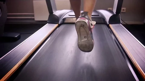 Back view of female legs walking and running on treadmill in gym, woman training Stock-Footage 74133710