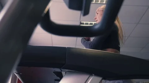 Back view of female legs walking and running on treadmill in gym, woman training Stock-Footage 74133731
