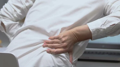 Back view of female manager working on laptop, feeling lower back pain, health Stock-Footage 117385019