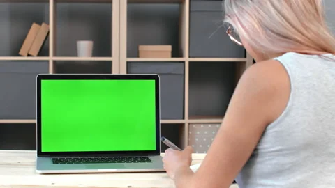 Back view female student making paper notes during elearning online education 動画素材 157672220