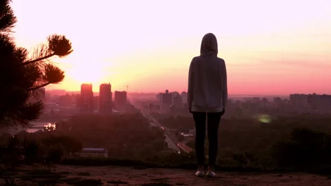 Back view female winner in town daybreak Stock Footage 132228729