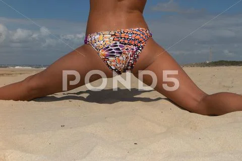 Back view of fit young woman in green bikini Stock Photos