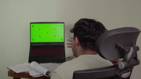 Back view of freelancer in front of laptop Stock Footage 320245000