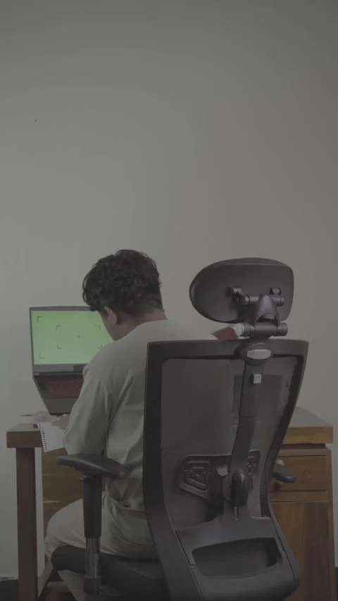 Back view of freelancer in front of laptop Stock Footage 320245881