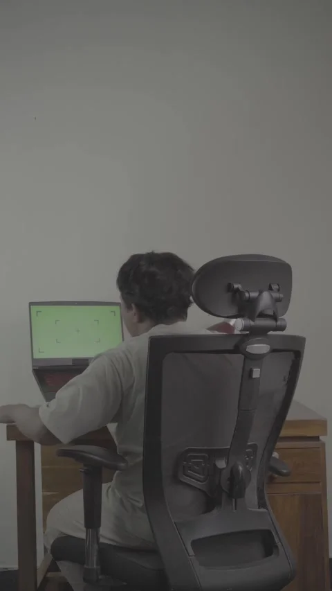 Back view of freelancer in front of laptop Video stock 320245900